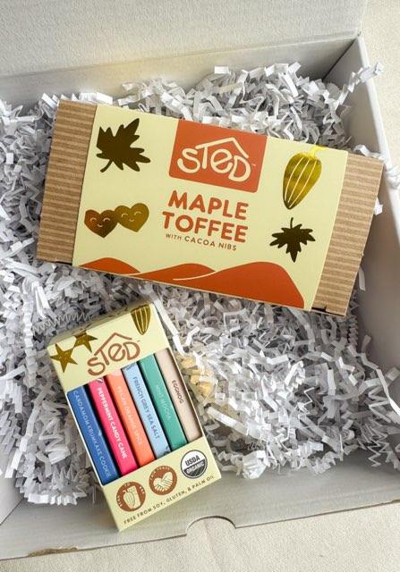 Sted Foods Chocolate Sampler Gift Box with Maple Toffee and assorted mini chocolate bars arranged in a festive gift box.