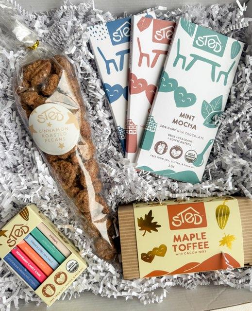 Sted Foods Deluxe Chocolate Gift Box — premium assortment with handcrafted bars, maple toffee, and candied pecans.