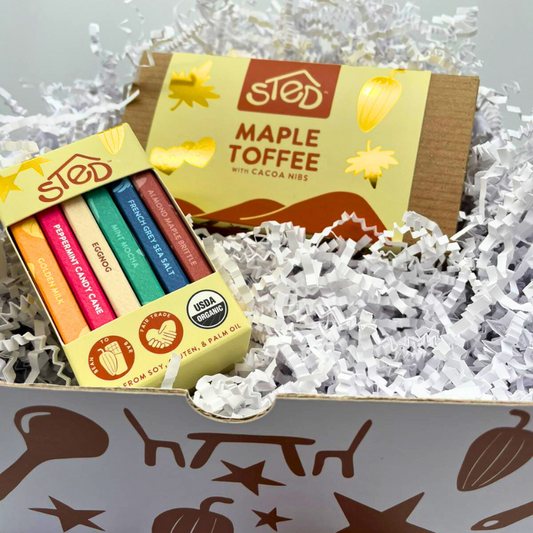 Sted Foods Chocolate Sampler Gift Box with Maple Toffee and assorted mini chocolate bars arranged in a festive gift box.